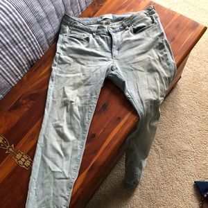 Faded wash pale skinny blue jeans.